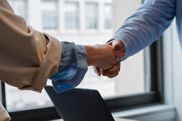 Voice & Data Consultant shaking hands with a business owner